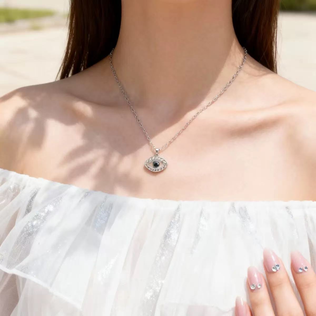 evil-eye-photo-projection-necklace-silver-worn