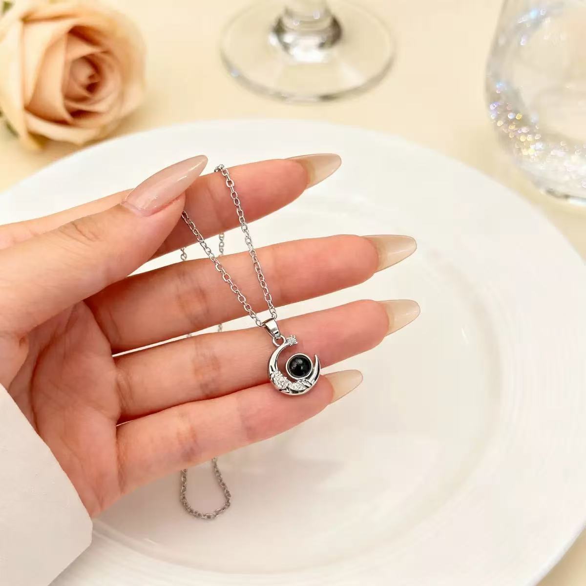 mini-moon-star-photo-projection-necklace-close-up