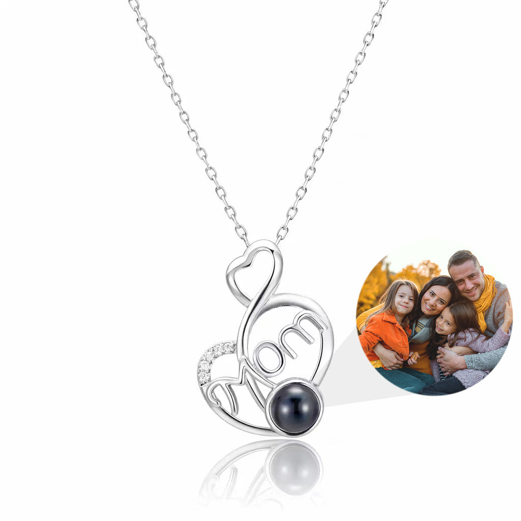 Custom heart and musical note photo projection necklace in silver, themed for Mom, with a hidden bead displaying a family photo